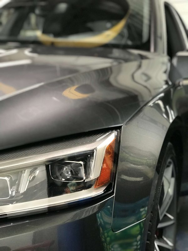 Clouded headlight restored to original clarity
